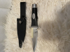 Schweres Messer mit Flaschenöffner